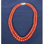 A vintage double string of coral beads