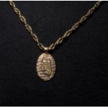 A 9ct gold pendant and chain with Taurus design