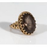 A 9ct gold ring set with a smoky quartz