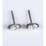 A pair of 18ct white gold 42pt marquis cut solitaire studs