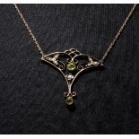 A 9ct gold seed pearl and peridot pendant