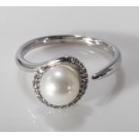 A 9ct white gold pearl and diamond ring