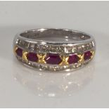 An 18ct white gold ruby (70pt) and diamond (1ct) princess cut half eternity ring