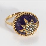 A 9ct gold cabouchon amethyst and seed pearl ring (8gms)