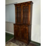 A Victorian mahogany two door bookcase .