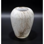 A white and gold studio glass vase