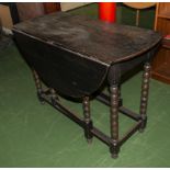 An oak gateleg table