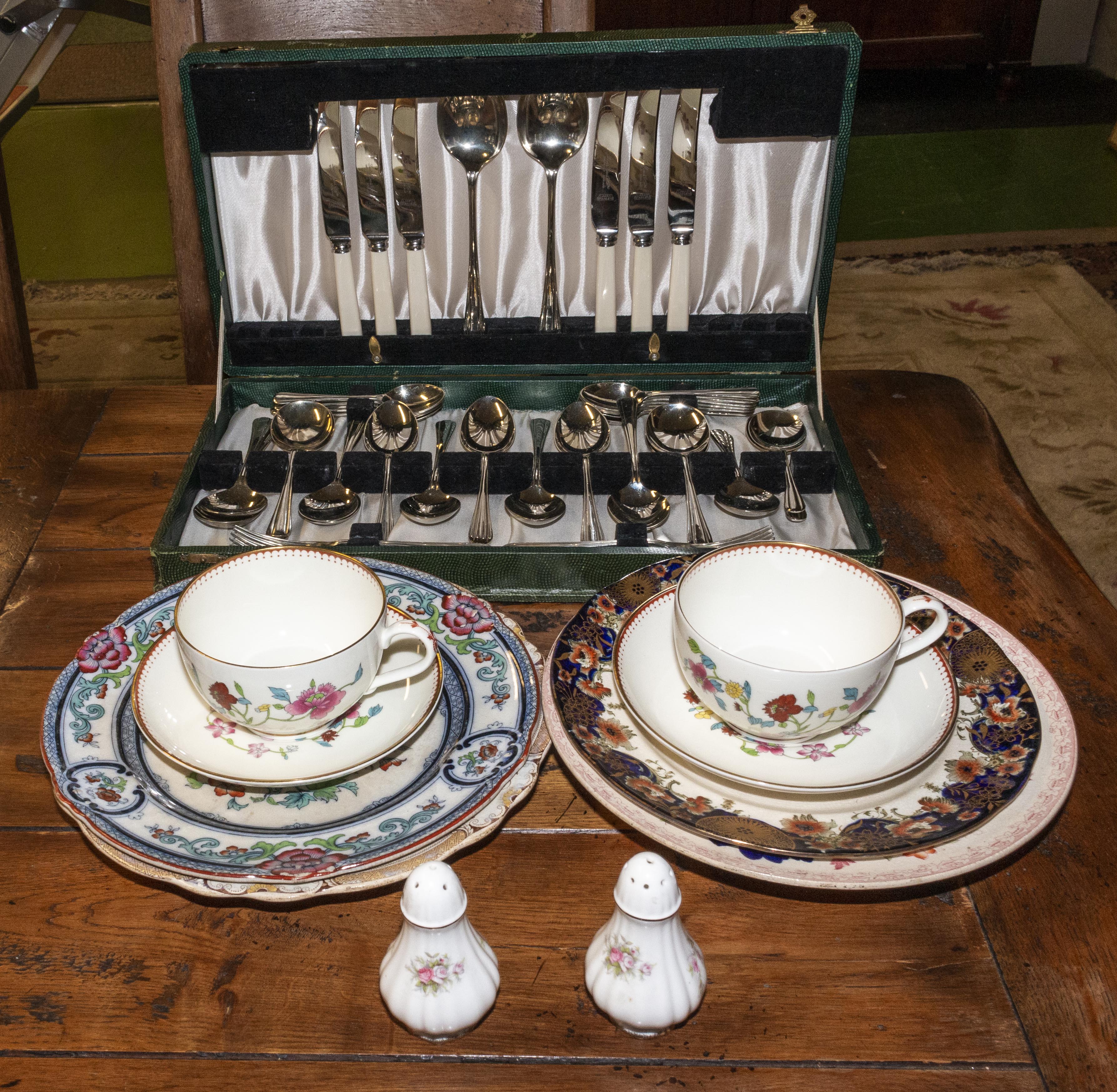 A cutlery box and pottery items.