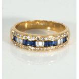 An 18ct gold sapphire and diamond half eternity ring
