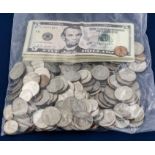 A bag of American leftover holiday money, coins and notes