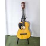 A Cordelia classical acoustic guitar and stand