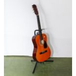A Lauren classical acoustic guitar and stand