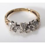A 9ct gold triple cluster diamond ring