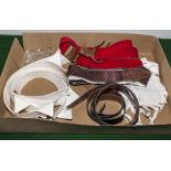 A box containing loose collars, studs and braces