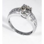 An 18ct white gold 1.12ct diamond solitaire ring with 30pt diamond shoulders