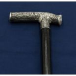A silver handled walking cane