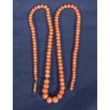 A vintage string of light coloured coral beads