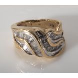 A 9ct gold baguette cut diamond wave Bombay style ring (1ct)