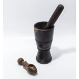 A vintage treen nut cracker together with a mortar and pestle