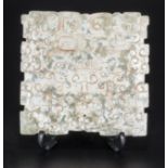 A Chinese Q'ing dynasty snow flake jade carved plaque