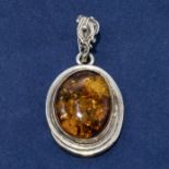 A Baltic amber and silver pendant