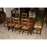 A large oak dining table with extra leaves 9ft 2 inch when fully extended by 3ft.(6ft 6 inch when