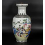A Chinese Republic vase decorated in Famile enamels depicting scholars, 37cm tall