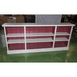A painted open bookcase