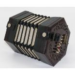 A concertina with label Manufactured Expressly for Joseph Higham Manchester, in fitted rosewood