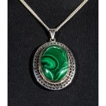 A large silver and malachite pendant with silver chain