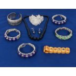 Seven bracelets, four with jade beads together earrings and beads