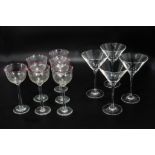 Four Martini glasses together with six wine glasses