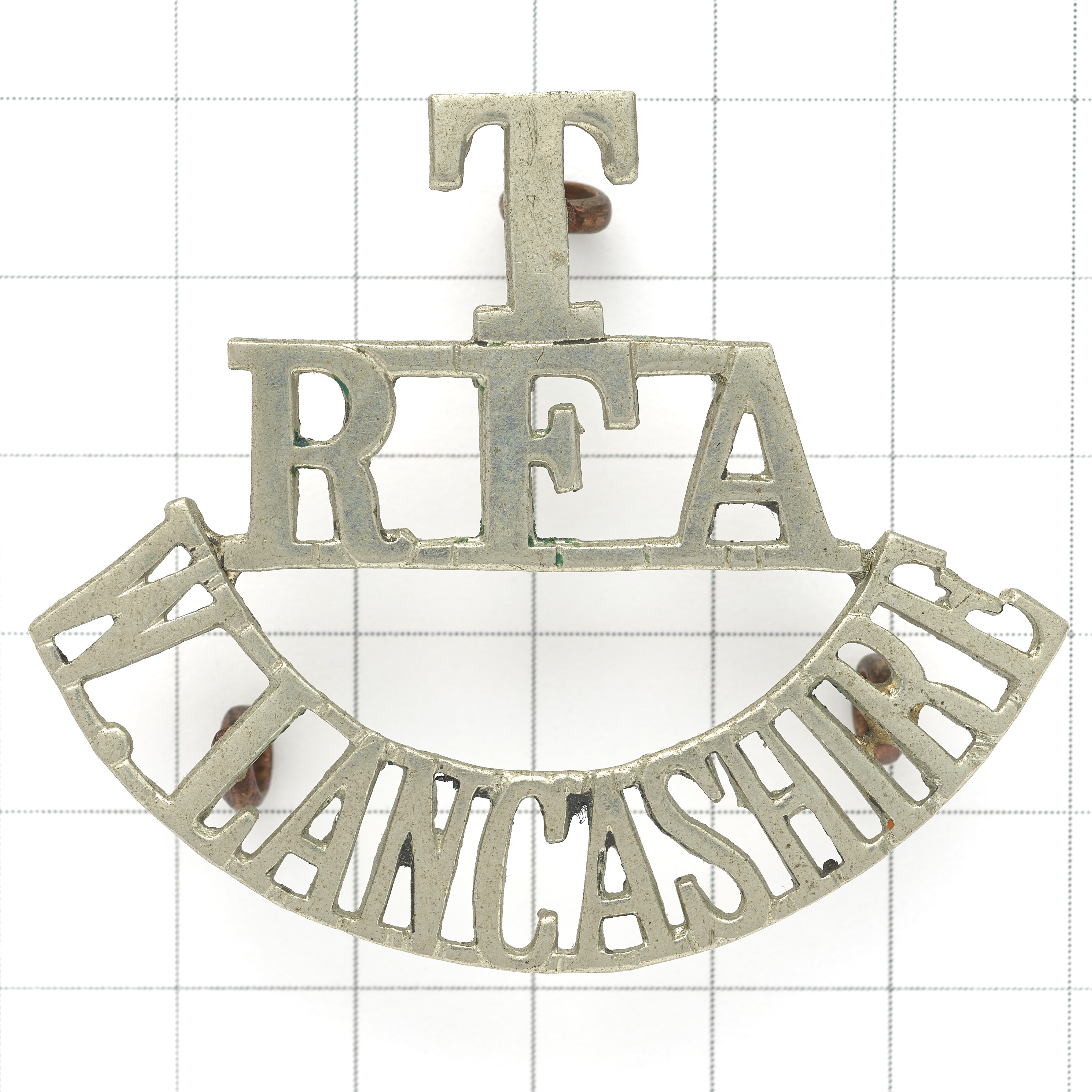 T / RFA / W.LANCASHIRE white metal Royal Field Artillery shoulder title circa 1908-20.