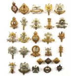 Selection of 21 Cavalry cap badges.