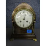 A late Victorian inlaid mahogany mantle clock, the arched case with inlaid brass stringing, with