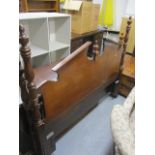A modern American walnut finished bedstead with a broken, arched headboard and turned pillars, 72 w