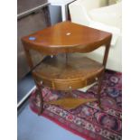 A George III mahogany corner wash stand with a single drawer, raised on splayed legs, 32h x 22w