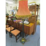 A mid 20th century gilt brass and green marble standard lamp with two fabric shades