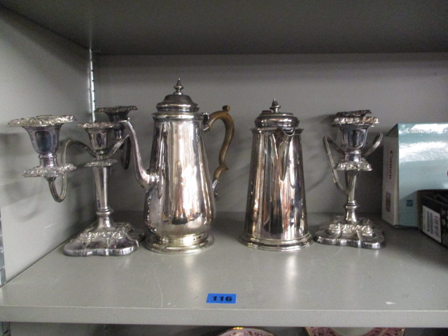 A pair of silver plated, three branch candelabras, a silver plated coffee pot on a spreading foot