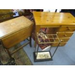 A modern pine desk with four short drawers, a small oak drop leaf table and a Victorian umbrella/