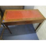 An Edwardian inlaid mahogany writing desk with a gilt tooled red leather scriber, two frieze drawers