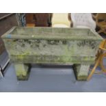 A 20th century composition stoneware trough planter, raised on twin pedestals, 31 1/2h x 46 1/2w