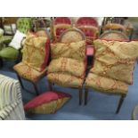 Three French oval backed dining chairs with a red and gold upholstery, together with four matching