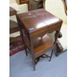 A George III mahogany wash stand having a twin panelled, hinged top over a shelf and a drawer, 35h x