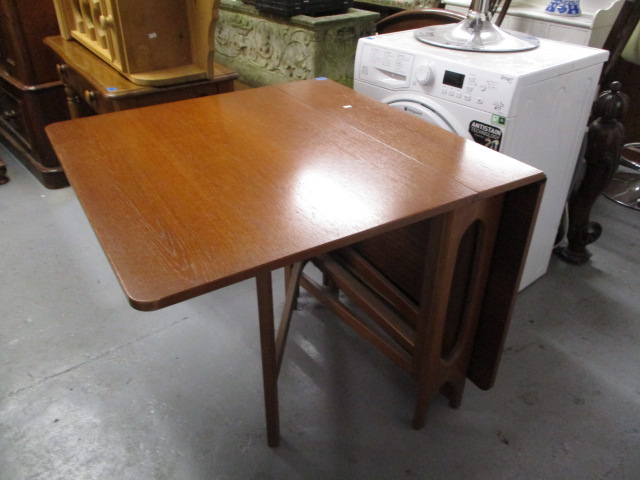 A mid 20th century teak gate leg table, 20 h x 57 w