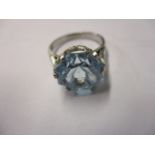 A platinum ring set with a large blue zircon