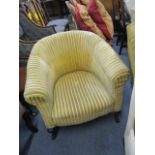 An early 20th century tub chair upholstred in a striped fabric, raised on stained beech cabriole