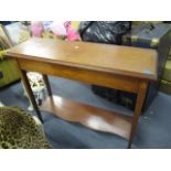 An Edwardian inlaid mahogany, two tier side table decorated with shell motifs, on square tapering