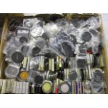 A box of camera lens caps and filters