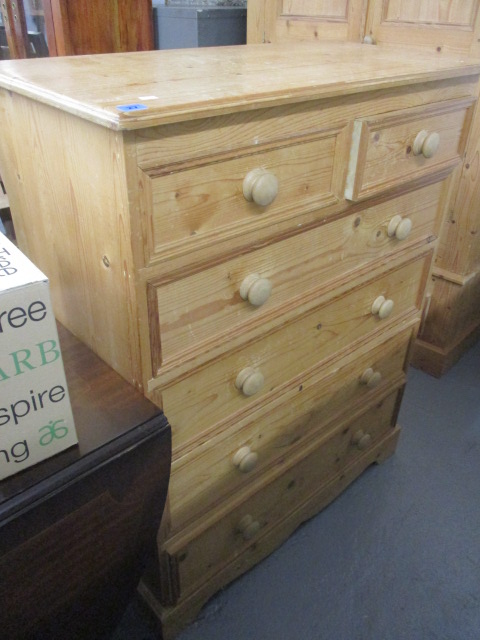 A modern pine chest of six drawers, raised on a bracket plinth, 46 h, 36 w